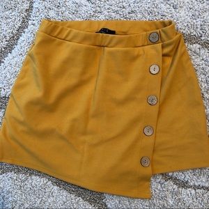 Mustard yellow skort(skirt with shorts underneath.